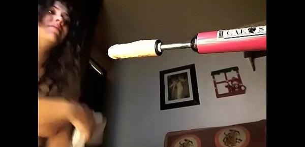  Brunette masturbates with a vibrator and a dildo machine